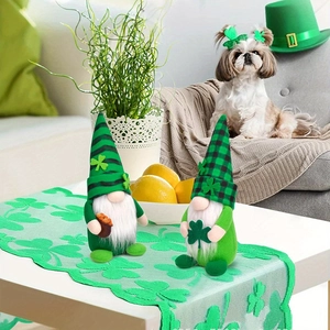 Saint Patrick's Day gnome figurines with green shamrock decor on a festive table runner