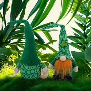 Saint Patrick's Day gnome plush duo with green hats and clover on a sunny grass background