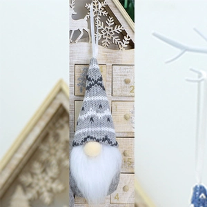 Detail of Christmas gnome ornament with grey knitted snowflake hat and plush white beard