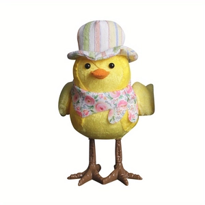 Detail of yellow Easter bird ornament with a striped hat and floral pink scarf decoration