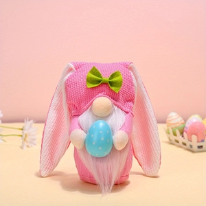 Pink Easter gnome plush with long rabbit ears holding a blue dotted egg decoration
