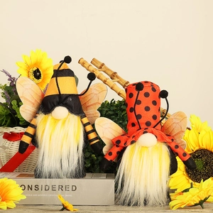 Handmade bee and ladybug themed faceless gnomes with sunflower autumn decor