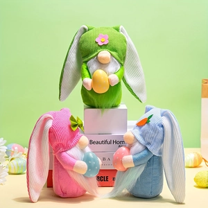 Three Easter bunny gnomes set with long ears and colorful eggs for holiday decoration