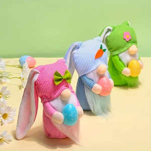 Three plush Easter gnomes with rabbit ears, holding colorful eggs for festive decoration