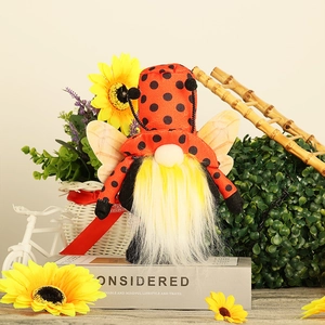 Handmade ladybug gnome plush with red polka dot hat and sunflowers decoration