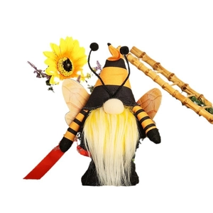 Bee festival gnome plush with yellow striped hat and sunflower on white background