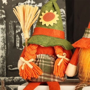 Harvest gnome doll with orange pigtails, sunflower green hat and straw broom decor
