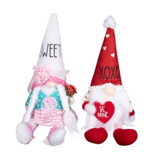 Pair of Valentine's Day gnomes plush decor with Sweet and XOXO heart signs on white background