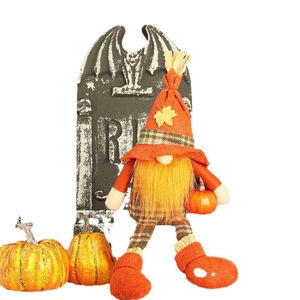 Halloween harvest gnome with orange hat and mini pumpkin on a clean white background