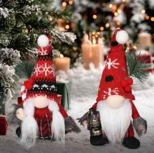 Detail of Christmas gnomes with striped candy canes and lanterns in a snowy setting