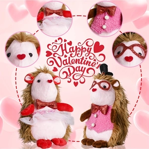 Pair of plush beaver dolls with Valentine outfits including glitter heart glasses and tutus