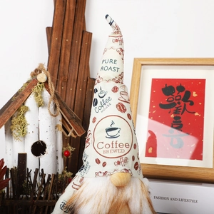 Close-up of coffee-themed gnome with knit hat and Pure Roast Coffee House prints