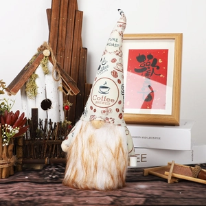 Detail of coffee themed Christmas gnome with knitted hat and plush beard on home shelf