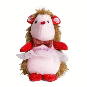 Detail of pink plush hedgehog doll with red heart nose, sequin bow, and ballet tutu dress