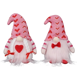 Pair of Valentine's Day pink plush gnomes with heart patterns and knitted hats