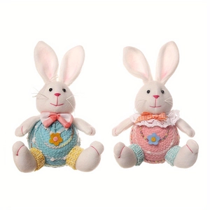 Detail of Easter bunny plush dolls with knitted bellies and cute ribbon bow accents