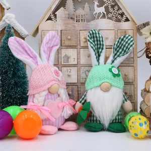 Close-up of Easter gnome plush set with pink rabbit ears and festive knit textures