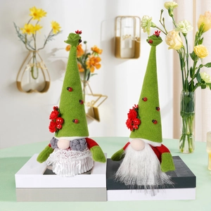 Pair of St. Patrick's Day gnomes with green clover hats and ladybug accents on pedestals