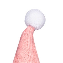 Detail of pink knitted Cupid gnome hat with white pom-pom and soft cable texture