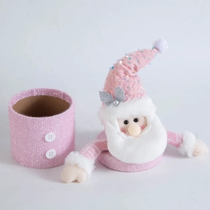 Detailed view of pink Santa gift box with sequined hat, plush beard and fabric texture