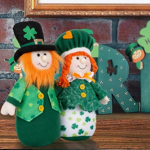Close-up of Saint Patrick's Day gnome plush dolls with green shamrocks and clover patterns