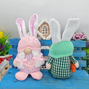Detail of pink and green Easter Gnomes with rabbit ears sitting on a blue wooden bench
