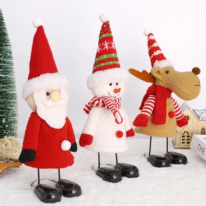 Three Christmas plush figures featuring Santa, Snowman, and Reindeer with spring legs
