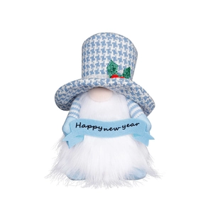 Detail of blue houndstooth hat and Happy New Year banner on festive gnome doll ornament