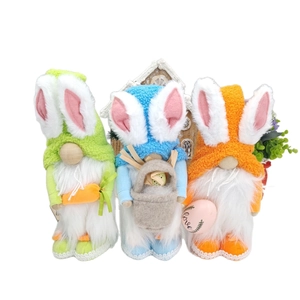Three colorful Easter rabbit gnomes in green, blue, and orange with plush bunny ears