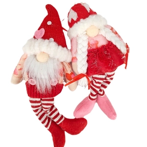 Pair of Valentine's Day plush gnomes with knitted heart hats and striped legs