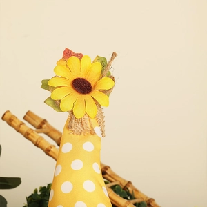 Close-up of harvest gnome hat with yellow sunflower, maple leaves and polka dots