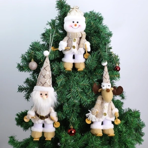Three champagne gold Christmas ski plush ornaments with Santa, Snowman, and Reindeer figures
