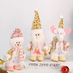 Three-piece Christmas plush dolls set with sequins and knitting hats on book display