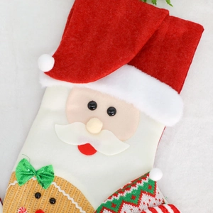 Christmas stocking hanging decoration featuring a Santa Claus design with green sequin bow