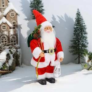 Standing Santa Claus figurine with red velvet suit and green gift bag on snowy landscape