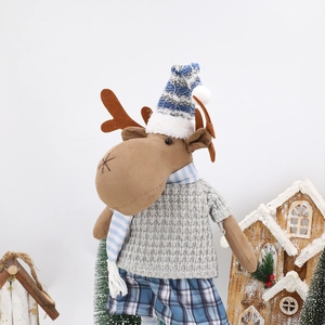 Detailed close-up of a Christmas moose plush doll in a cozy festive winter scene