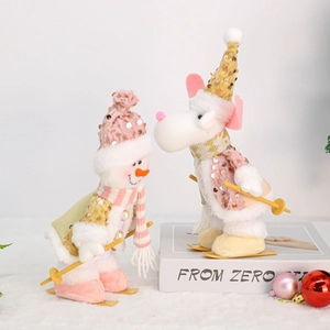 Detail of plush Christmas snowman and reindeer dolls with sequined hats and ski gear