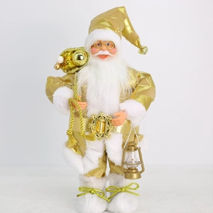 Standing Santa Claus figure in gold and white robe with gift bag and lantern decoration
