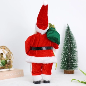 Standing Santa Claus doll in red velvet with a green gift bag on a festive background
