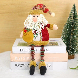 Christmas Santa doll with red knit coat and long beaded legs sitting on book decor