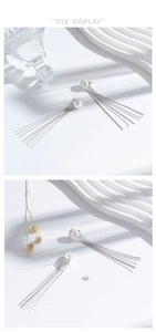 Dettaglio di orecchini di perle con lunghe nappe a frangia d'argento e chiusura a perno