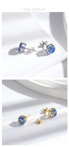 Détails des boucles d'oreilles en argent et or avec zircons bleus ronds étincelants