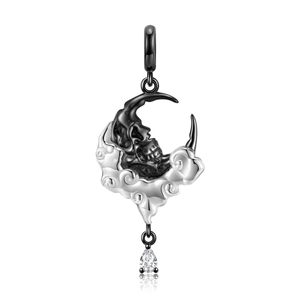 Macro detail of Gothic S925 moon skull pendant with black plating and pear-cut gemstone