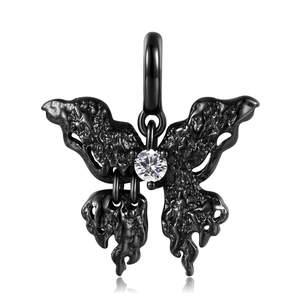 Macro detail of a black lava-textured butterfly pendant with a central sparkling zircon