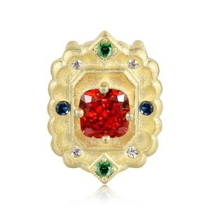 Macro detail of S925 sterling silver 14k gold necklace with red gemstone and crystals
