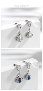 Detailed view of silver fan-shaped earrings with blue and white teardrop zircons