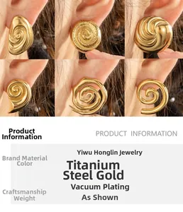 Detail of vacuum plated golden titanium steel earrings in various spiral and hammered designs