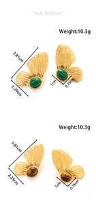Detail of gold butterfly earrings with malachite and tiger eye inlays and size labels