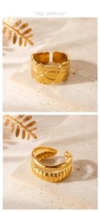 Detailed view of adjustable golden wide ring with irregular textured surface on stone