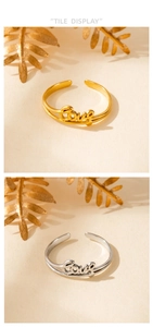 Flache Ansicht verstellbarer Ringe in Gold und Silber mit Love-Schriftzug und Doppelband